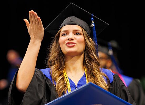 A graduate celebrates at 在线博彩 commencement