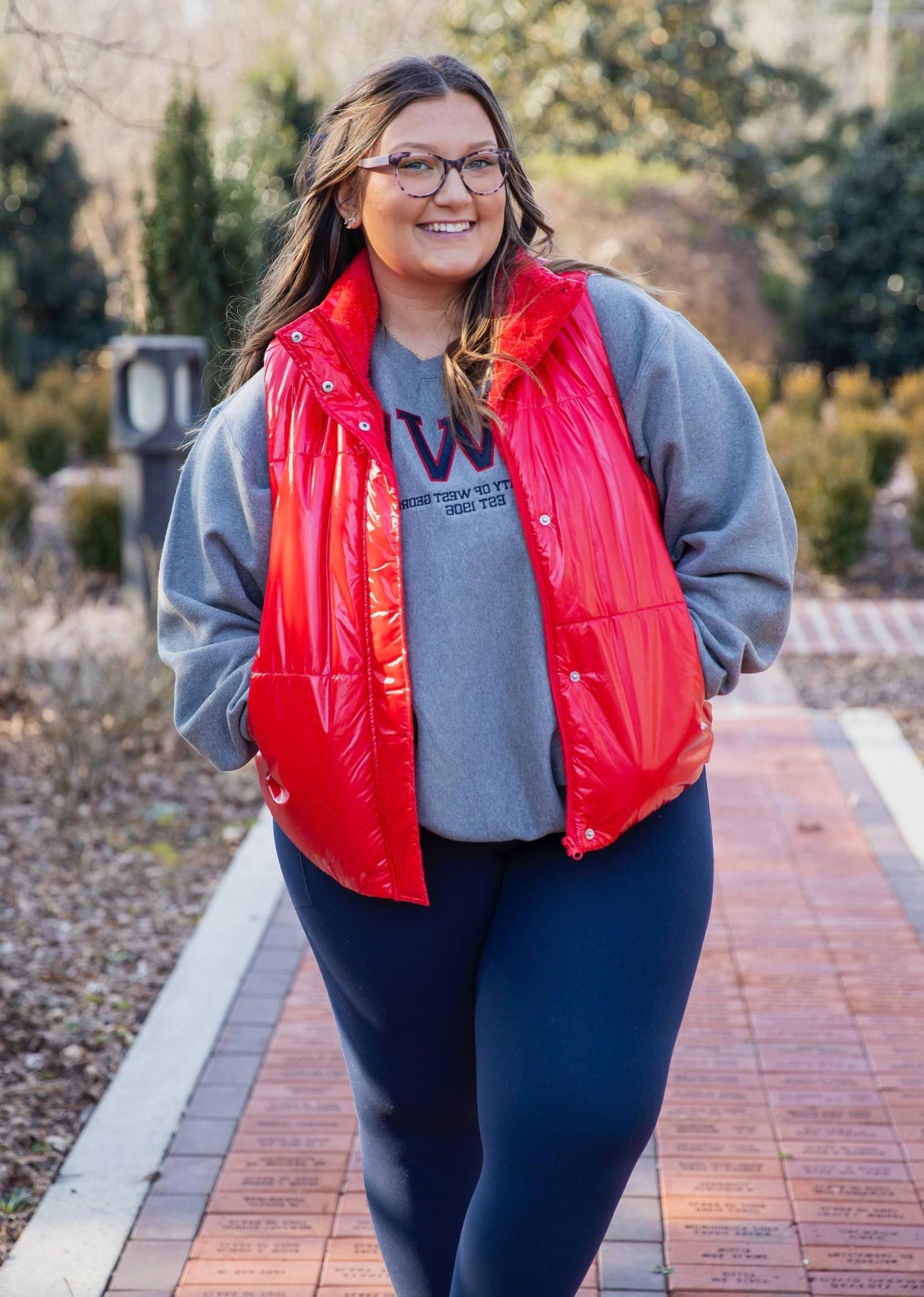 Alexis Wentz posing in the Alumni Garden for pictures.