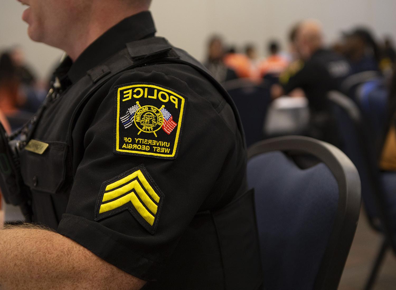 Side view of university police officers badge.